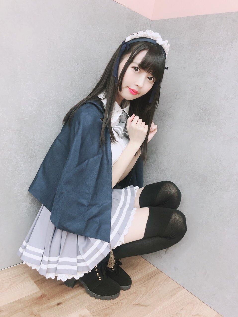 1girl, afilia_magic_senior_high_school, black_socks, grey_skirt, highres, photo_(medium), skirt, socks