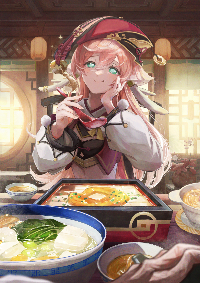 1girl, :t, absurdres, bowl, commentary_request, crop_top, food, genshin_impact, green_eyes, hand_on_own_cheek, hand_on_own_face, hands_up, head_tilt, highres, indoors, long_hair, long_sleeves, looking_at_viewer, midriff, nakauma, pink_hair, pom_pom_(clothes), red_headwear, smile, tofu, upper_body, very_long_hair, yanfei_(genshin_impact)