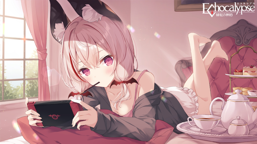 1girl, animal_ear_fluff, animal_ears, barefoot, bat_hair_ornament, blonde_hair, cake, cake_slice, camelia_(echocalypse), collarbone, copyright_name, cup, curtains, echocalypse, food, frills, grey_jacket, hair_ornament, handheld_game_console, highres, holding, holding_handheld_game_console, hoshi_(snacherubi), jacket, lying, multicolored_hair, off_shoulder, official_art, on_bed, on_stomach, pillow, pocky, purple_eyes, second-party_source, streaked_hair, teacup, teapot, the_pose, window