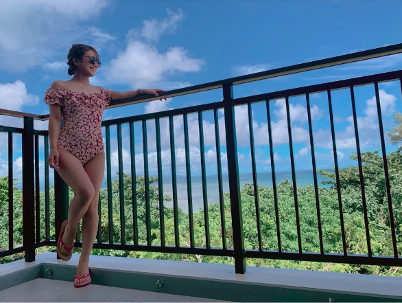 1girl, blue_sky, horizon, one-piece_swimsuit, photo_(medium), sky, sunglasses, swimsuit