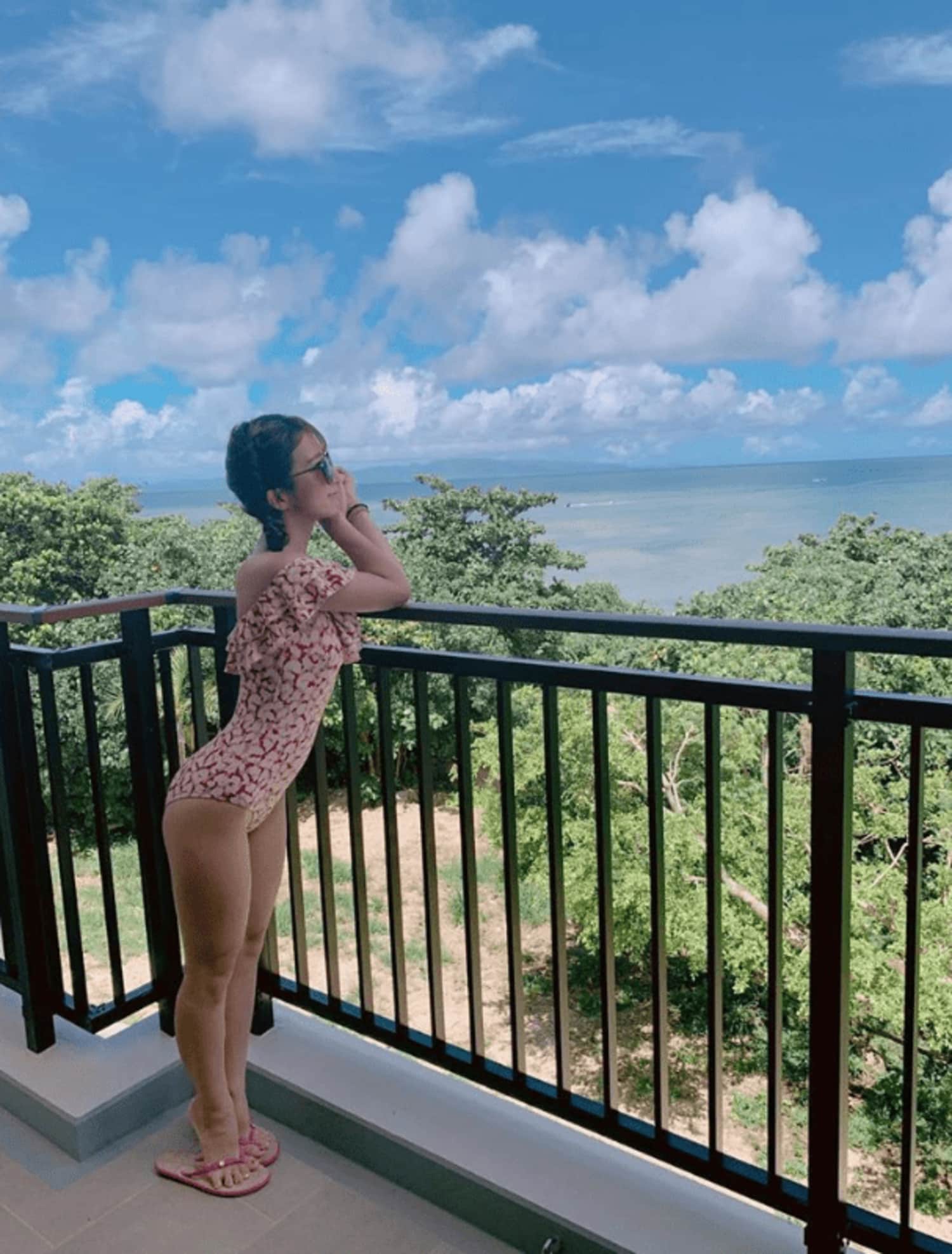 1girl, blue_sky, highres, horizon, one-piece_swimsuit, photo_(medium), sky, sunglasses, swimsuit, tree, tsuji_nozomi