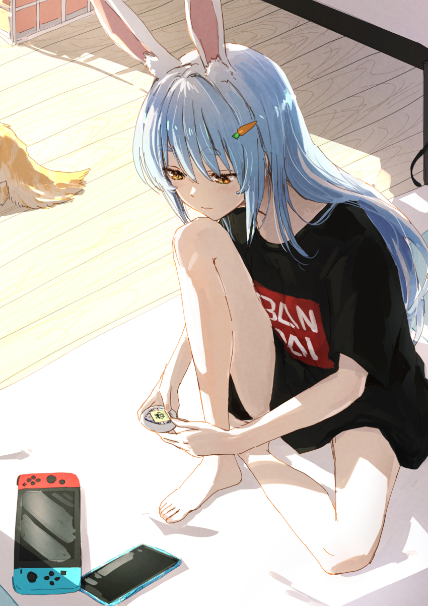 1girl, alternate_costume, animal_ear_fluff, animal_ears, bandai, bare_legs, barefoot, black_shirt, blue_hair, carrot_hair_ornament, cellphone, commentary_request, feet, food-themed_hair_ornament, full_body, hair_ornament, highres, hololive, indoors, knee_up, legs, logo, long_hair, nintendo_switch, no_pants, on_ground, phone, rabbit_girl, shadow, shirt, sidelocks, sitting, smartphone, solo, t-shirt, tamagotchi, tamagotchi_(virtual_pet), tamagotchi_meets, thick_eyebrows, thighs, toenails, toes, usada_pekora, virtual_pet_(toy), virtual_youtuber, wooden_floor, yami_ara, yellow_eyes