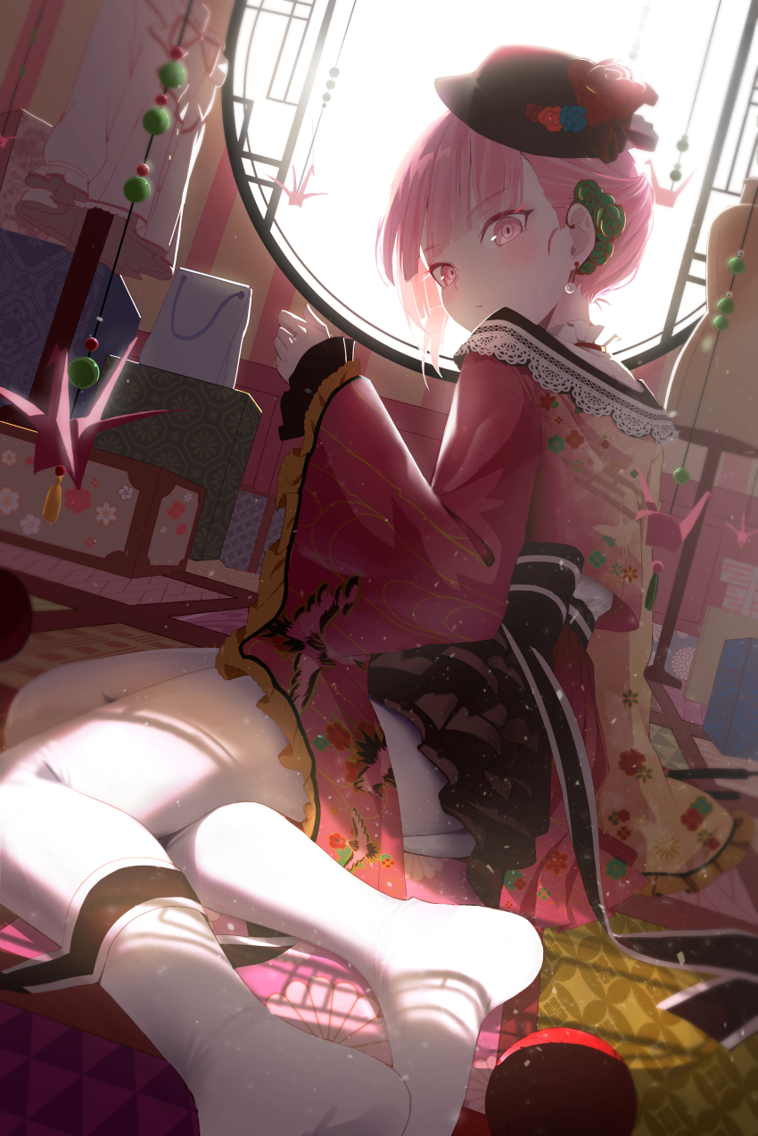 1girl, absurdres, akiyama_mizuki, black_hat, closed_mouth, commentary_request, earrings, floral_print, flower, hair_flower, hair_ornament, hand_up, hat, hat_flower, highres, indoors, japanese_clothes, jewelry, kawaranu_atatakasa_no_tonari_de_(project_sekai), kimono, long_sleeves, looking_at_viewer, looking_back, no_shoes, nun_nu, origami, pantyhose, paper_crane, pink_eyes, pink_hair, print_kimono, project_sekai, reclining, red_kimono, short_hair, solo, white_pantyhose, wide_sleeves, yarn, yarn_ball