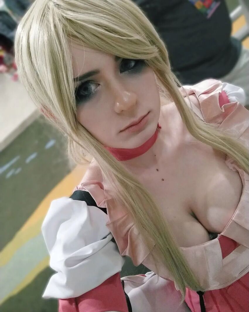 1boy, bad_girl_(cosplay), bad_girl_(no_more_heroes), blonde_hair, breasts, cleavage, cosplay, dress, highres, medium_breasts, no_more_heroes, photo_(medium), pink_dress, real_life, selfie