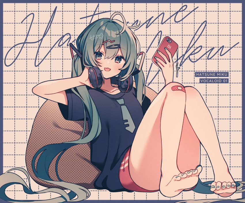 1girl, :3, alternate_costume, amagi_hana, bandaid, bandaid_on_knee, bandaid_on_leg, bare_legs, barefoot, bean_bag_chair, blue_shorts, border, cellphone, character_name, commentary_request, green_eyes, green_hair, grid_background, hair_ornament, hairclip, hatsune_miku, headphones, highres, holding, holding_phone, long_hair, looking_at_viewer, nail_polish, necktie_print, open_mouth, phone, red_shorts, short_sleeves, shorts, smile, solo, toenail_polish, toenails, twintails, very_long_hair, vocaloid