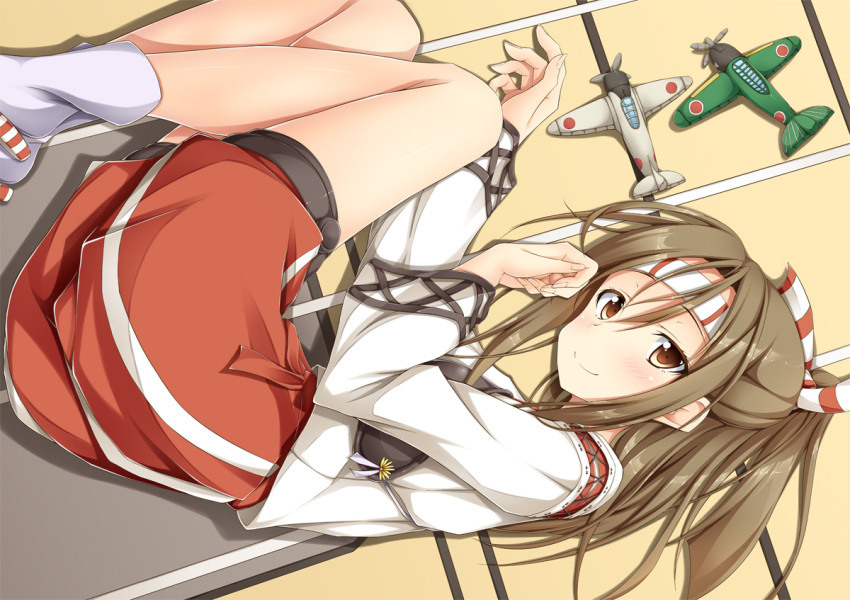 1girl, blush, brown_eyes, brown_hair, fetal_position, hachimaki, hair_ribbon, headband