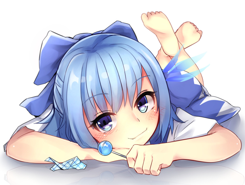 1girl, barefoot, blue_dress, blue_eyes, blue_hair, blush, candy, cirno, dress, ice, ice_wings, legs_up, lollipop, lying, on_stomach, shirt, short_sleeves, smirk, solo, toku_0012, touhou, wings