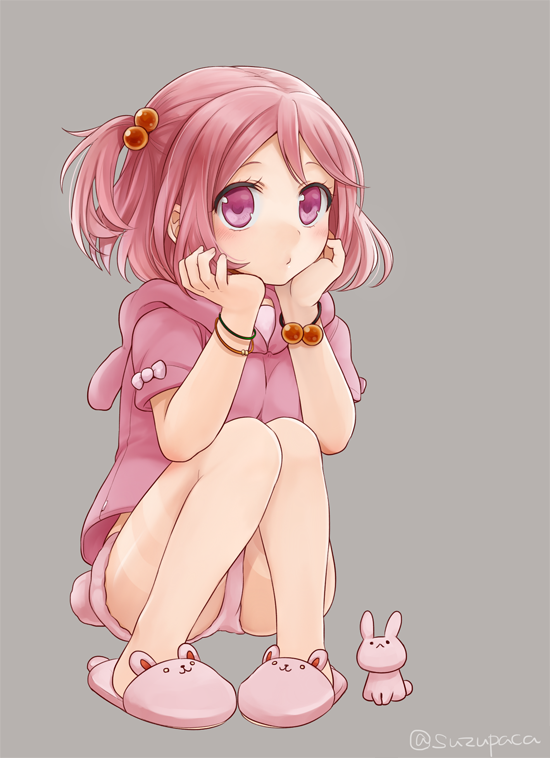 1girl, animal_slippers, blush, bracelet, bunny_slippers, chin_rest, grey_background, hair_bobbles, hair_ornament, hoodie, jewelry, kantai_collection, pigeon-toed, pink_eyes, pink_hair, rabbit, sazanami_(kantai_collection), short_hair, side_ponytail, slippers, solo, squatting, suzuka_(rekkyo), twitter_username