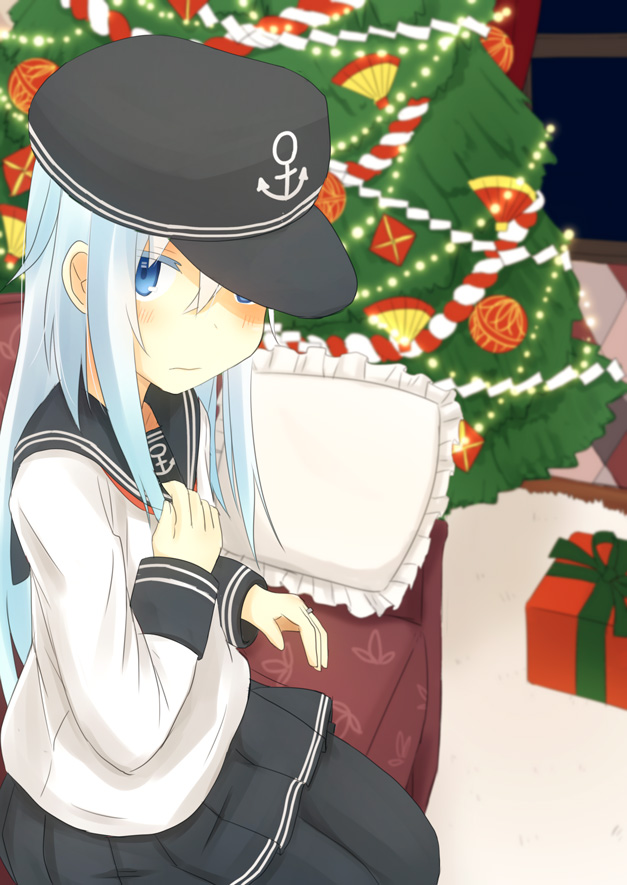 1girl, aqua_eyes, aqua_hair, black_legwear, black_skirt, blouse, blurry, blush, box, christmas, christmas_tree, couch, depth_of_field, flat_cap, gift, gift_box, hand_on_own_chest, hat, hat_over_one_eye, hatomaru, hibiki_(kantai_collection), indoors, jewelry, kantai_collection, long_sleeves, looking_at_viewer, neckerchief, pantyhose, pillow, pleated_skirt, ring, sailor_collar, school_uniform, serafuku, sitting, skirt, solo, wedding_band