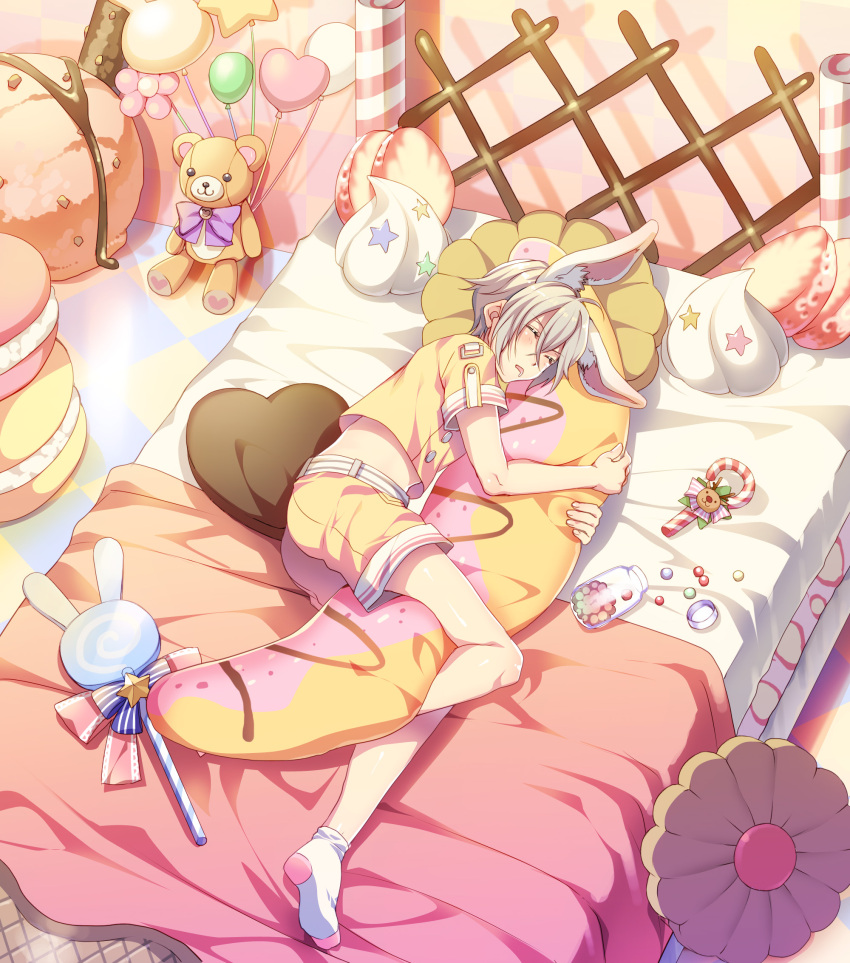 1boy, animal_ears, balloon, bed, candy, candy_cane, cookie, drooling