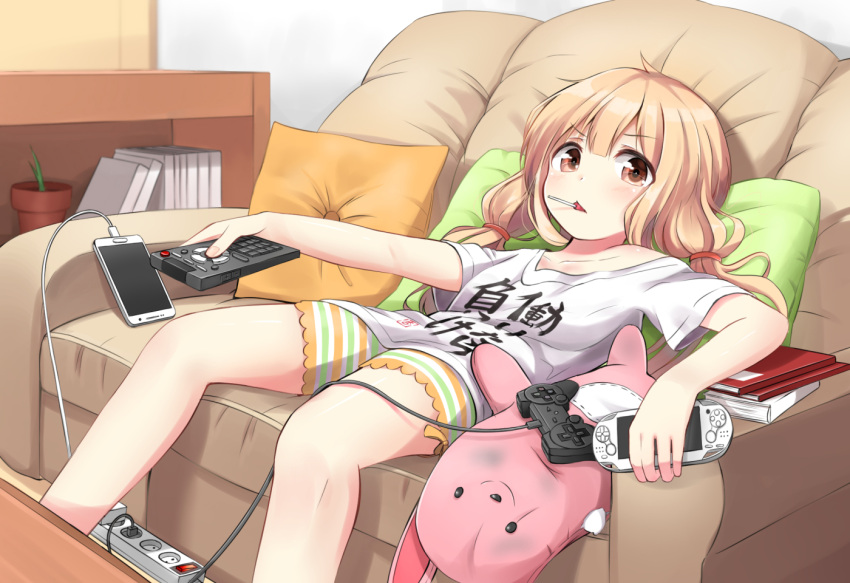 1girl, arm_rest, blonde_hair, book_stack, candy, cellphone, clothes_writing, controller