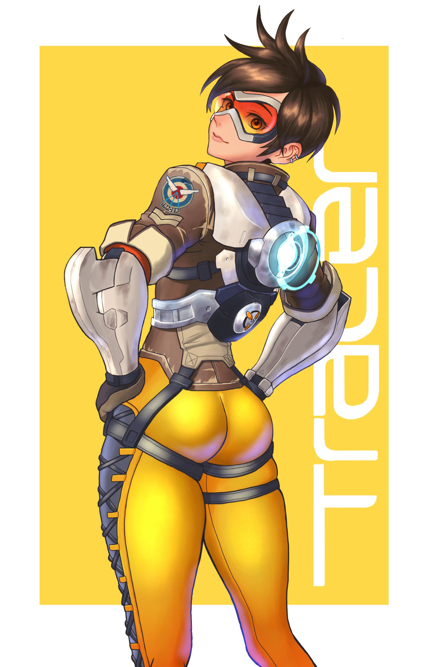 1girl, absurdres, ass, back, bangs, black_hair, bodysuit, brown_hair, character_name, closed_mouth, clothes_writing, cross-laced_clothes, earrings, from_below, gloves, glowing, goggles, hands_on_hips, highres, jacket, jewelry, looking_at_viewer, looking_back, overwatch, shigatsugata, short_hair, skin_tight, smile, solo, swept_bangs, thigh_strap, tracer_(overwatch), white_border, yellow_background