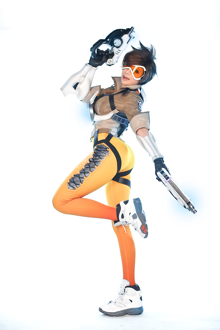 1girl, asian, bodysuit, cosplay, gun, overwatch, photo, solo