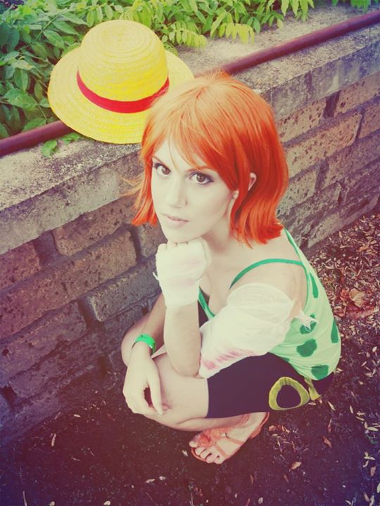 1girl, camisole, cosplay, hat, nami_(one_piece), nami_(one_piece)_(cosplay), one_piece, orange_hair
