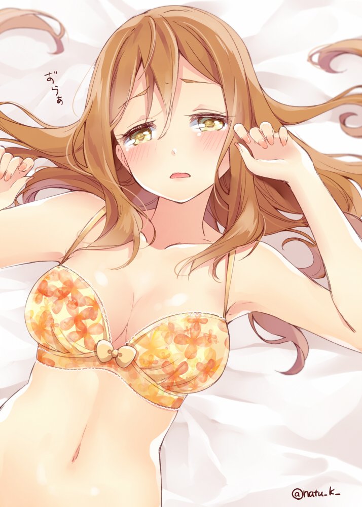 1girl, bangs, bed, bed_sheet, blush, bra, breasts, brown_eyes, brown_hair, floral_print, flower_bra, hair_between_eyes, half-closed_eyes, jpeg_artifacts, kunikida_hanamaru, long_hair, love_live!, love_live!_sunshine!!, lying, midriff, natsu_(natume0504), navel, on_back, open_mouth, solo, twitter_username, underwear, yellow_eyes