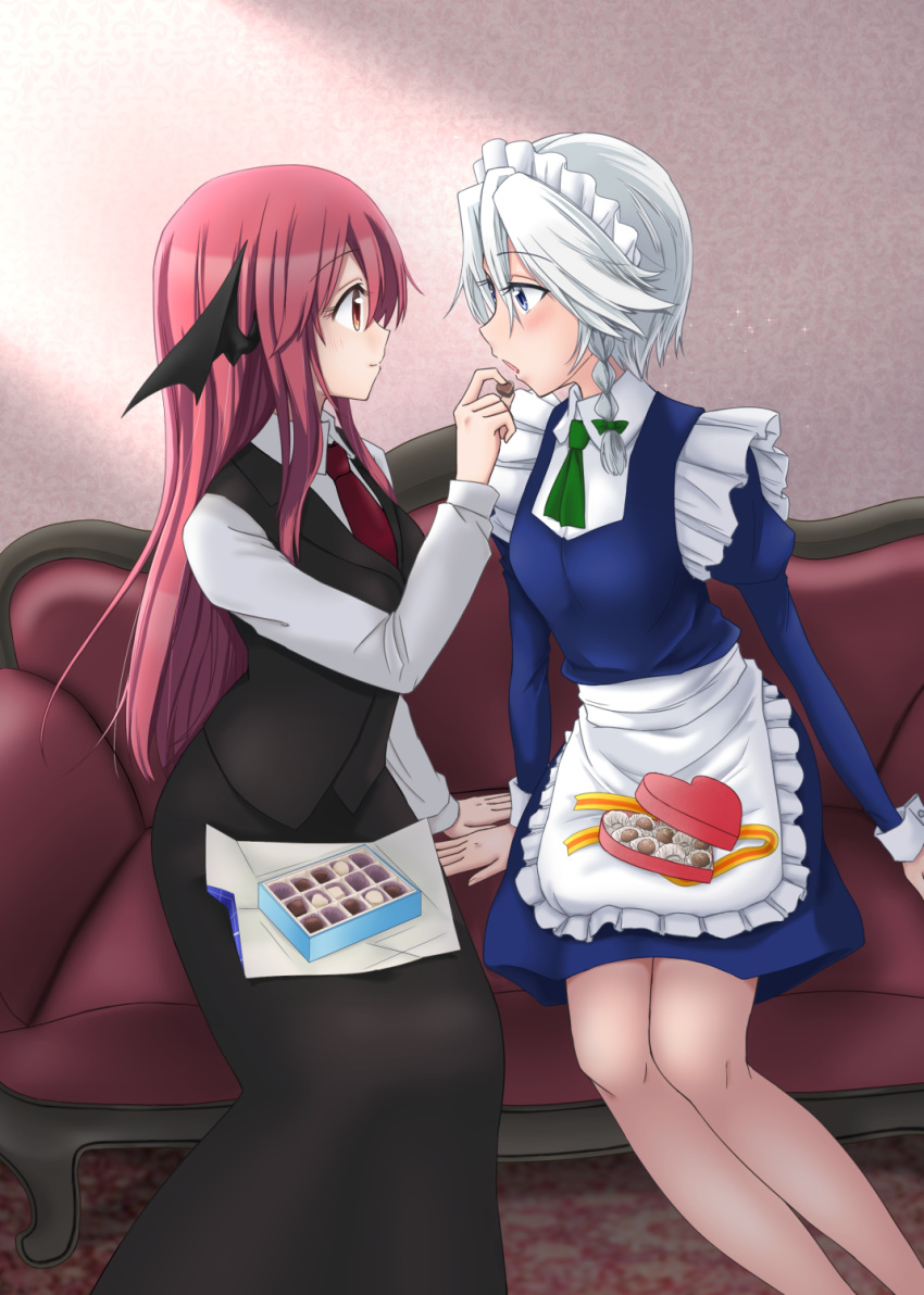 2girls, 3692materia, apron, black_skirt, blue_dress, blue_eyes, braid, chocolate, couch, dress, dress_shirt, eye_contact, feeding, hair_ribbon, head_wings, heart-shaped_box, highres, indoors, izayoi_sakuya, juliet_sleeves, koakuma, light_smile, long_hair, long_sleeves, looking_at_another, maid_headdress, multiple_girls, necktie, open_mouth, puffy_sleeves, red_eyes, red_necktie, redhead, ribbon, shirt, short_hair, silver_hair, sitting, skirt, touhou, tress_ribbon, twin_braids, waist_apron, waistcoat, yuri