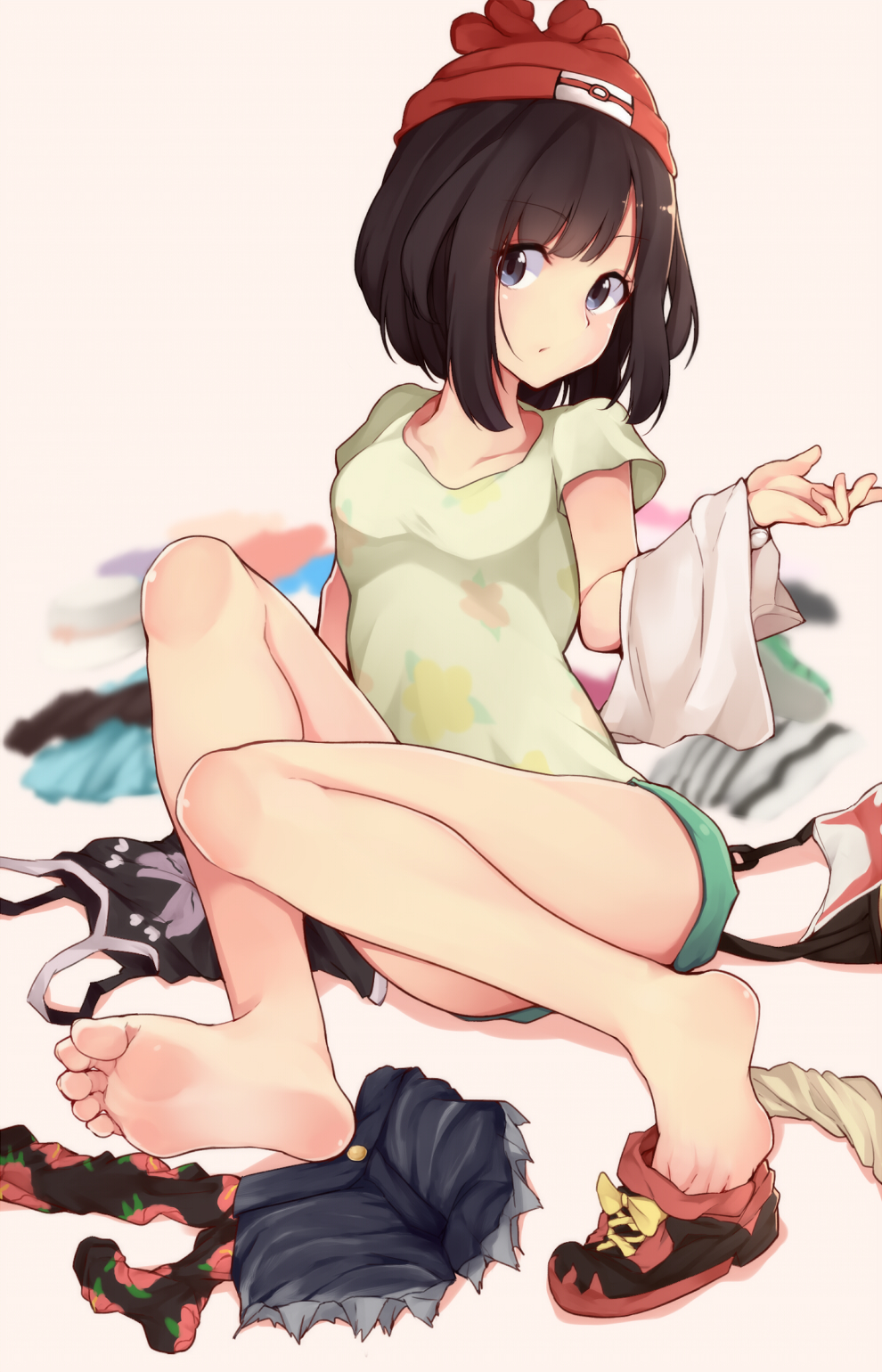 1girl, bangs, barefoot, batatata77, beanie, black_hair, blue_hair, blurry, blurry_background, clothes, clothes_removed, denim, denim_shorts, feet, floral_print, green_shorts, hat, highres, looking_at_viewer, mizuki_(pokemon_sm), pokemon, pokemon_(game), pokemon_sm, shoes, shoes_removed, short_hair, short_shorts, short_sleeves, shorts, shorts_removed, single_shoe, soles, solo, tan_background, toes