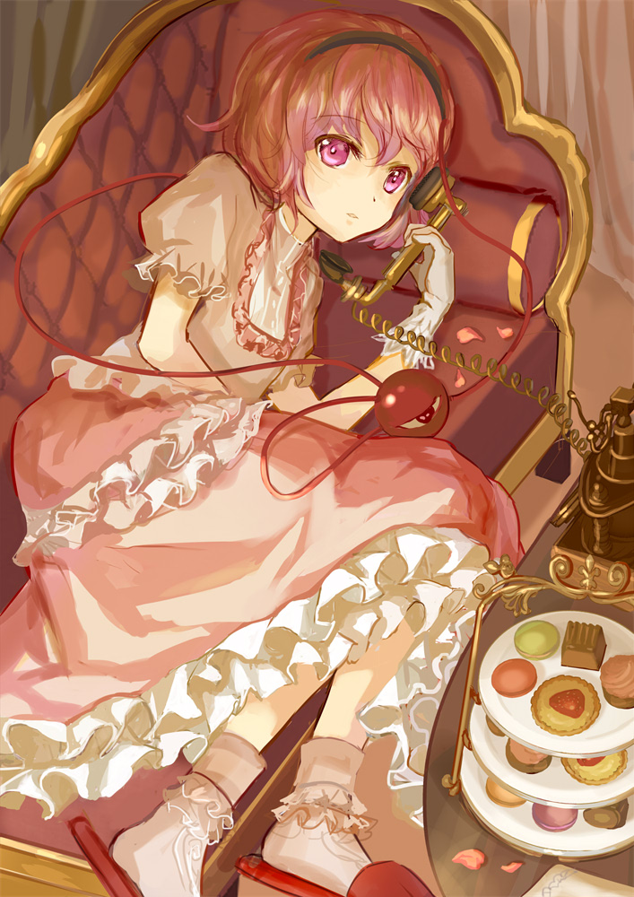 1girl, alternate_costume, ankle_socks, antique_telephone, cake, chaise_longue, dress, food, frilled_dress, frills, gloves, hairband, indoors, keiko_(mitakarawa), komeiji_satori, layered_dress, looking_at_viewer, lying, macaron, on_side, pink_dress, pink_eyes, pink_hair, puffy_short_sleeves, puffy_sleeves, reclining, short_sleeves, slippers, solo, talking_on_phone, third_eye, touhou, tray, white_gloves