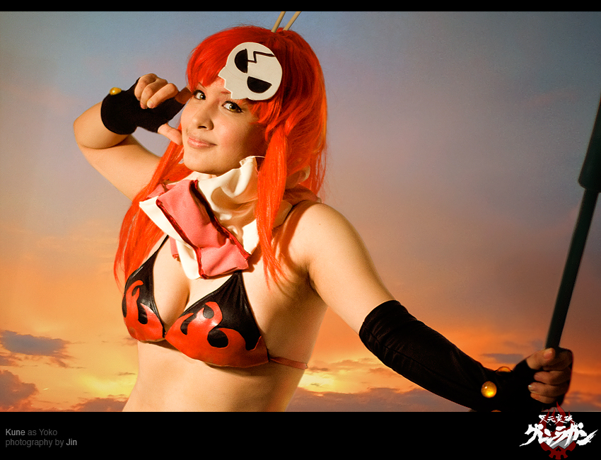 asian, bikini_top, brown_eyes, cosplay, fingerless_gloves, flame_print, hair_chopsticks, hair_ornament, holding_weapon, long_gloves, looking_at_viewer, medium_breasts, photo, pose, red_hair, scarf, skinny, skull_hair_ornament, smile, sunset, tengen_toppa_gurren_lagann, yoko_littner, yoko_littner_(cosplay), yoko_ritona