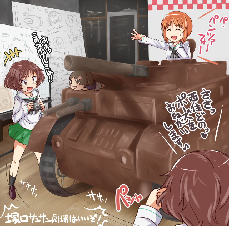 2girls, :d, akiyama_yukari, anglerfish, bangs, black_legwear, black_neckwear, blouse, brown_eyes, brown_footwear, brown_hair, camera, character_doll, chocolate, closed_eyes, commentary_request, dual_persona, emblem, eyebrows_visible_through_hair, girls_und_panzer, green_skirt, ground_vehicle, hand_to_throat, holding, indoors, kitayama_miuki, loafers, long_sleeves, messy_hair, military, military_vehicle, miniskirt, motor_vehicle, multiple_girls, neckerchief, nishizumi_miho, ooarai_school_uniform, open_mouth, outstretched_arm, pleated_skirt, school_uniform, serafuku, shoes, short_hair, skirt, smile, socks, standing, sweatdrop, taking_picture, tank, translation_request, vehicle_request, white_blouse