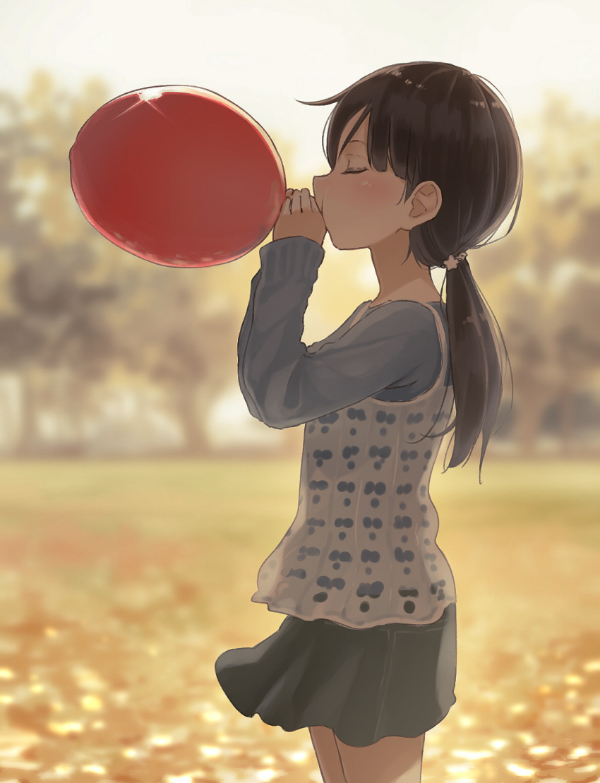 1girl, ball, balloon, bangs, black_hair, black_skirt, blowing, blurry, blurry_background, blush, brown_hair, child, closed_eyes, commentary, cowboy_shot, from_side, gin_(minamito3), hands_up, highres, holding, holding_ball, holding_balloon, layered_clothing, long_hair, long_sleeves, miniskirt, muted_color, open_mouth, original, outdoors, ponytail, red_balloon, skirt, sleeves_past_wrists, solo, standing, swept_bangs, tree