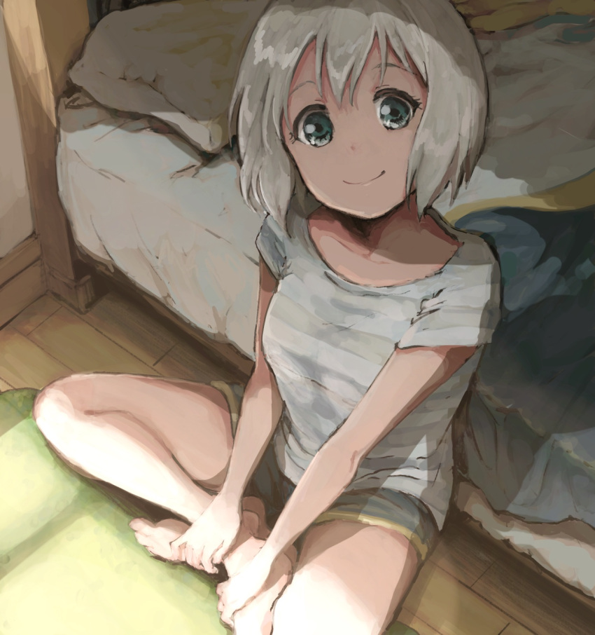 1girl, aoba_moca, bang_dream!, bangs, barefoot, bed, blue_eyes, commentary_request, crossed_ankles, grey_hair, grey_shirt, hands_on_own_leg, highres, indoors, looking_at_viewer, pillow, rii_(hakumaiiiiii), shirt, short_shorts, short_sleeves, shorts, sitting, smile, solo, wooden_floor