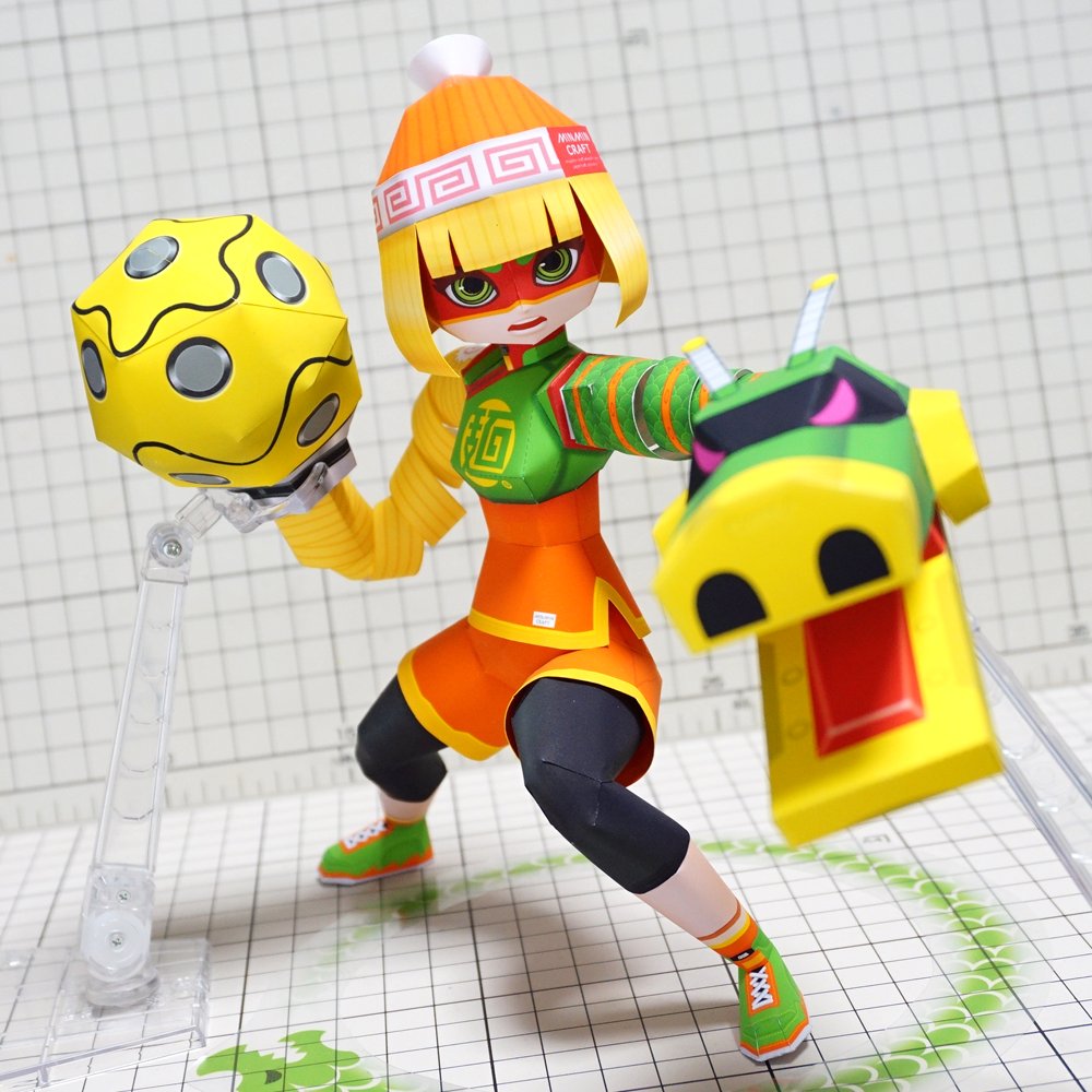 1girl, arms_(game), bangs, beanie, black_legwear, blonde_hair, chinese_clothes, domino_mask, dragon, full_body, green_eyes, green_footwear, hat, leggings, legwear_under_shorts, looking_at_viewer, mask, min_min_(arms), muumin_(muumin_craft), open_mouth, orange_shorts, papercraft, photo, shoes, short_hair, shorts, solo