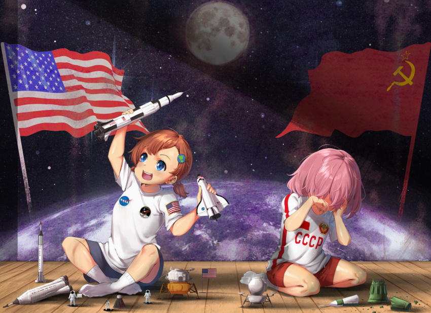 2girls, :d, american_flag, astronaut, bangs, blue_eyes, blue_shorts, brown_hair
