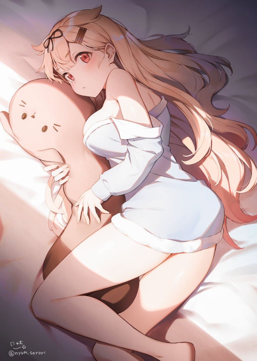 1girl, absurdres, animal_pillow, bangs, bare_shoulders, bed_sheet, blonde_hair, blush, breasts, eyebrows_visible_through_hair, hair_flaps, hair_ornament, hair_ribbon, hairclip, highres, kantai_collection, large_breasts, long_hair, long_sleeves, lying, nyum, off_shoulder, on_side, open_mouth, pillow, red_eyes, remodel_(kantai_collection), ribbon, shirt, signature, solo, twitter_username, yuudachi_(kantai_collection)