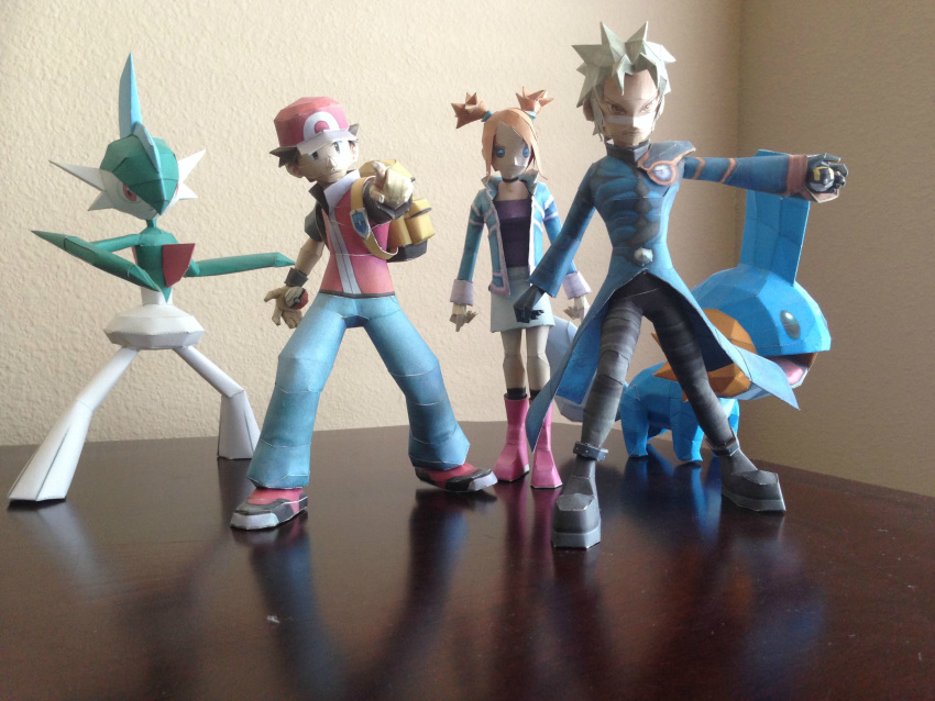 1girl, 2boys, backpack, bag, baseball_cap, brown_hair, commentary, creature, denim, english_commentary, gallade, gen_3_pokemon, gen_4_pokemon, grey_hair, hat, highres, hoennborn, holding, holding_poke_ball, jeans, legs_apart, leo_(pokemon), long_sleeves, mirei_(pokemon_colosseum), mudkip, multiple_boys, multiple_sources, orange_hair, pants, papercraft, photo, poke_ball, poke_ball_(generic), pokemon, pokemon_(creature), pokemon_(game), pokemon_colosseum, pokemon_frlg, red_(pokemon), red_headwear, short_sleeves, short_twintails, standing, super_smash_bros., twintails, ultra_ball, vs_seeker