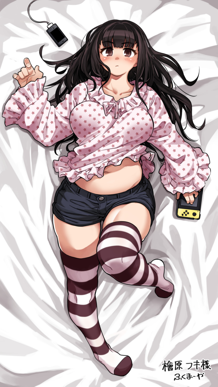 1girl, :/, bangs, bed_sheet, belly, black_hair, blouse, blush, breasts, brown_eyes, cellphone, charger, collarbone, dakimakura, dated, eyebrows_visible_through_hair, frilled_sleeves, frills, fukumaaya, full_body, handheld_game_console, highres, holding_handheld_game_console, knee_up, large_breasts, long_hair, long_sleeves, looking_at_viewer, lying, messy_hair, midriff, navel, nintendo, nintendo_switch, no_shoes, on_back, original, phone, plump, short_shorts, shorts, sleeves_past_wrists, smartphone, solo, star, star_print, striped, striped_legwear, thigh-highs