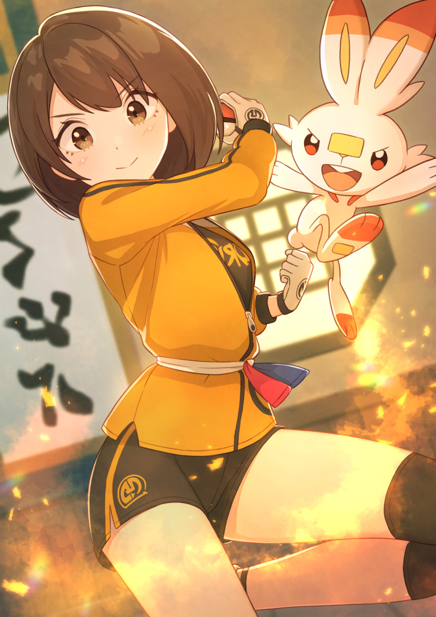 1girl, bangs, blush, brown_eyes, brown_hair, clenched_hand, closed_mouth, commentary, eyebrows_visible_through_hair, eyelashes, gen_8_pokemon, gloria_(pokemon), gloves, highres, holding, holding_poke_ball, jacket, knee_pads, long_sleeves, looking_at_viewer, master_dojo_uniform, poke_ball, poke_ball_(basic), pokemon, pokemon_(game), pokemon_swsh, sash, scorbunny, short_hair, shorts, tanbonota46, white_gloves, yellow_jacket, zipper_pull_tab