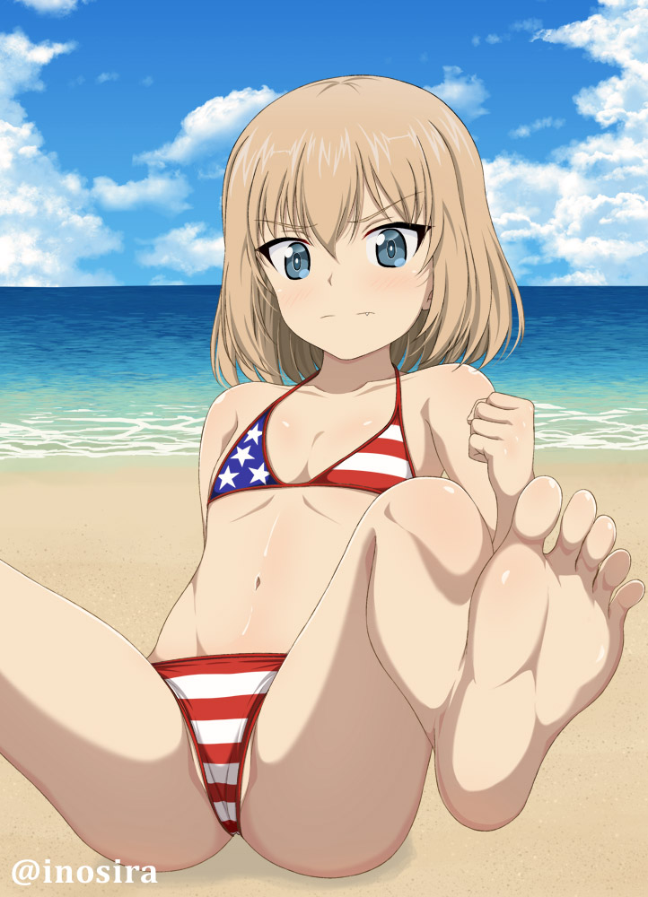 1girl, american_flag_bikini, beach, bikini, blonde_hair, blue_eyes, feet, flag_print, flat_chest, girls_und_panzer, inoshira, katyusha_(girls_und_panzer), looking_at_viewer, medium_hair, midriff, navel, ocean, sky, soles, swimsuit, toes