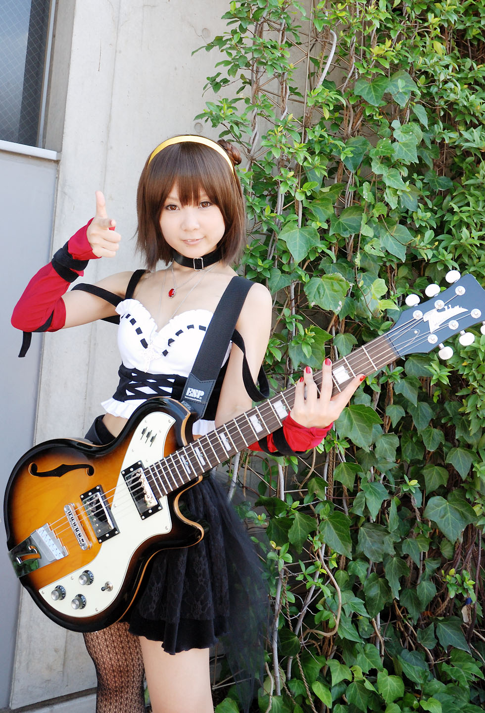 belt, cosplay, elbow_gloves, fishnet_stockings, guitar, hairband, hiromichi, one_kneehigh, one_thighhigh, photo, suzumiya_haruhi, suzumiya_haruhi_no_yuuutsu