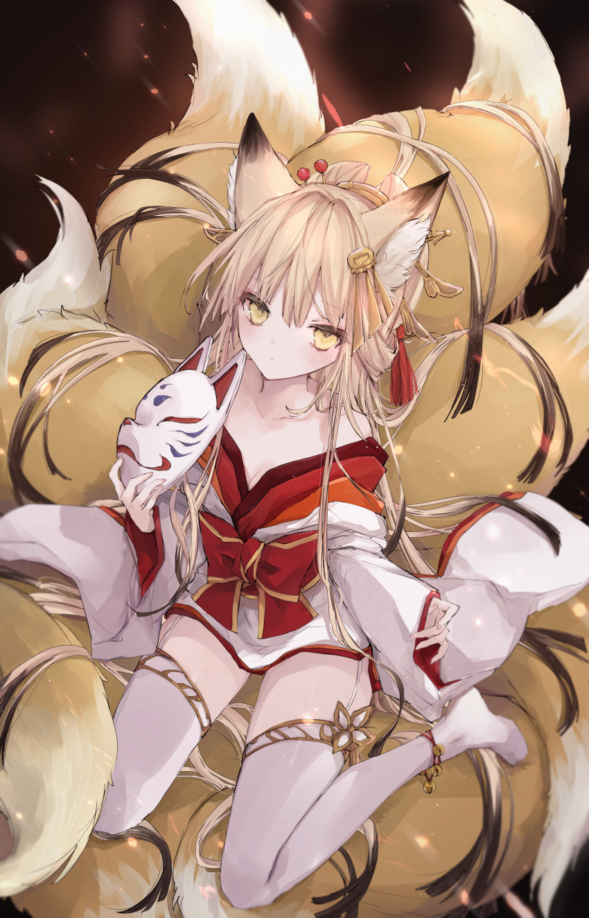 1girl, absurdres, animal_ear_fluff, animal_ears, ankle_bell, ankle_ribbon, bangs, bare_shoulders, bell, blonde_hair, character_request, collarbone, commentary_request, commission, expressionless, fox_ears, fox_girl, fox_mask, fox_tail, from_above, highres, holding, holding_mask, japanese_clothes, jewelry, jingle_bell, kimono, kyuubi, long_hair, long_sleeves, looking_at_viewer, mask, multiple_tails, no_shoes, nyanko_daisensou, ribbon, si10ra, sidelocks, sitting, solo, tail, thigh-highs, very_long_hair, wariza, white_legwear, wide_sleeves, yellow_eyes