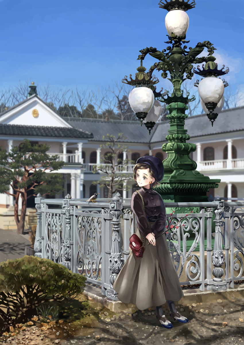 1girl, absurdres, bag, bird, black_headwear, black_legwear, blue_sky, blurry, brown_blouse, brown_hair, building, bush, buttons, closed_mouth, clouds, commentary_request, day, depth_of_field, earrings, fence, full_body, green_eyes, grey_skirt, handbag, hat, highres, house, jewelry, lamppost, leaning_back, long_skirt, long_sleeves, looking_at_animal, looking_to_the_side, original, outdoors, own_hands_together, railing, rainycity, rock, scenery, shoes, short_hair, skirt, sky, smile, solo, standing, starling, tree, white_footwear