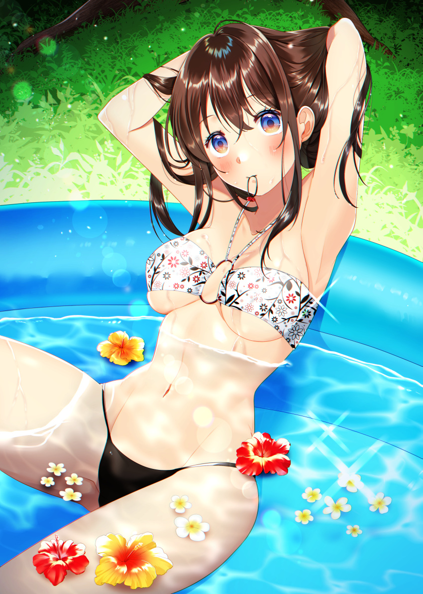 1girl, absurdres, armpits, arms_behind_head, arms_up, bandeau, bangs, bikini, blush, breasts, brown_hair, caustics, chromatic_aberration, day, floral_print, flower, grass, hair_tie, hair_tie_in_mouth, halterneck, hibiscus, highres, hitsuji_kumo, knee_up, lens_flare, long_hair, looking_at_viewer, medium_breasts, moe2021, mouth_hold, navel, o-ring, o-ring_top, original, outdoors, partially_submerged, reclining, sidelocks, swimsuit, tying_hair, under_boob, violet_eyes, wading_pool, water, wet