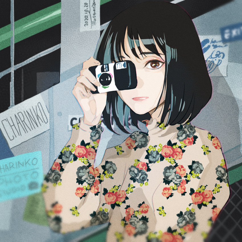 1girl, black_hair, brown_eyes, camera, charinko_manga, floral_print, highres, holding, holding_camera, long_sleeves, looking_at_viewer, medium_hair, one_eye_covered, original, print_shirt, shadow, shirt, solo, upper_body