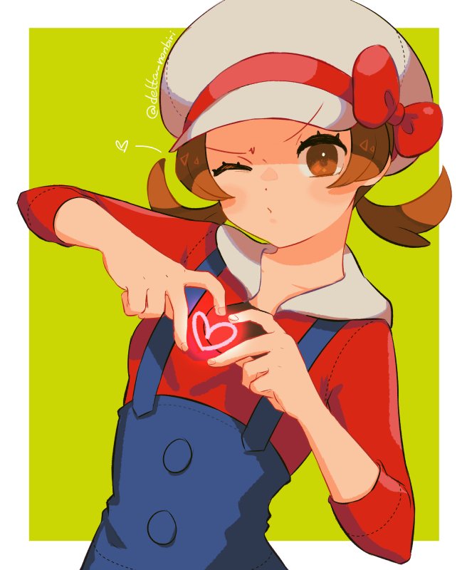 1girl, artist_name, blush, border, brown_eyes, brown_hair, closed_mouth, collarbone, commentary, delta_nonbiri, eyelashes, green_background, hands_up, hat, hat_ribbon, heart, heart_hands, looking_at_viewer, lyra_(pokemon), outside_border, overalls, pokemon, pokemon_(game), pokemon_hgss, red_ribbon, red_shirt, ribbon, shirt, sleeves_past_elbows, solo, twintails, upper_body, white_border, white_headwear