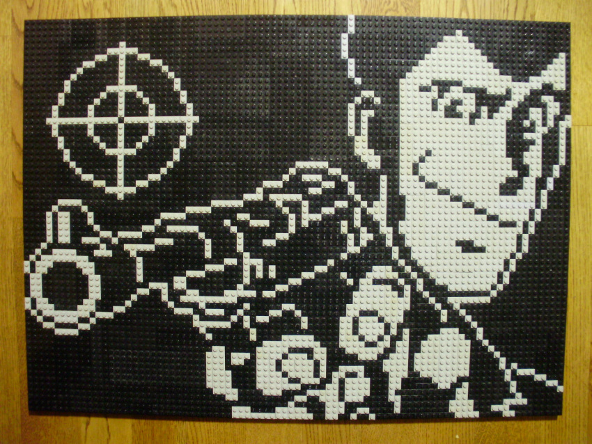 1boy, arsene_lupin_iii, closed_mouth, gun, highres, holding, holding_gun, holding_weapon, lego, lego_(medium), looking_at_viewer, lupin_iii, male_focus, monochrome, photo_(medium), pixel_art, short_hair, solo, unconventional_media, upper_body, weapon, you_rei_(blowback)