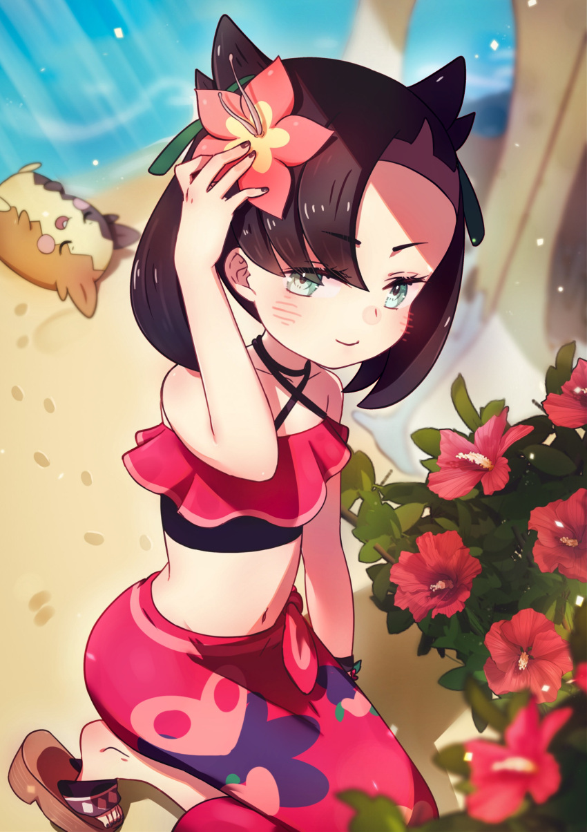 1girl, absurdres, asymmetrical_bangs, bangs, beach, bikini, bikini_top, black_bikini, black_hair, blush, bush, eyebrows_visible_through_hair, flower, footprints, frilled_bikini, frills, gen_8_pokemon, gracidea, green_eyes, hair_flower, hair_horns, hair_ornament, halter_top, halterneck, highres, holding, holding_flower, koka12312, long_skirt, marnie_(pokemon), medium_hair, midriff, morpeko, navel, official_alternate_costume, pink_bikini, pink_flower, pink_skirt, pokemon, pokemon_(game), pokemon_masters_ex, sand, sandals, skirt, swimsuit, twintails