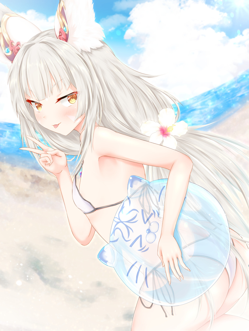 1girl, animal_ears, ass, ball, bangs, beach, beachball, bikini, blush, cowboy_shot, curved_horizon, day, facial_mark, flat_chest, flower, from_behind, hair_flower, hair_ornament, highres, horizon, konowa_(pixiv30906526), looking_back, low_twintails, nia_(blade)_(xenoblade), nia_(xenoblade), outdoors, oversized_breast_cup, silver_hair, solo, swimsuit, tongue, tongue_out, twintails, v, white_bikini, xenoblade_chronicles_(series), xenoblade_chronicles_2, yellow_eyes