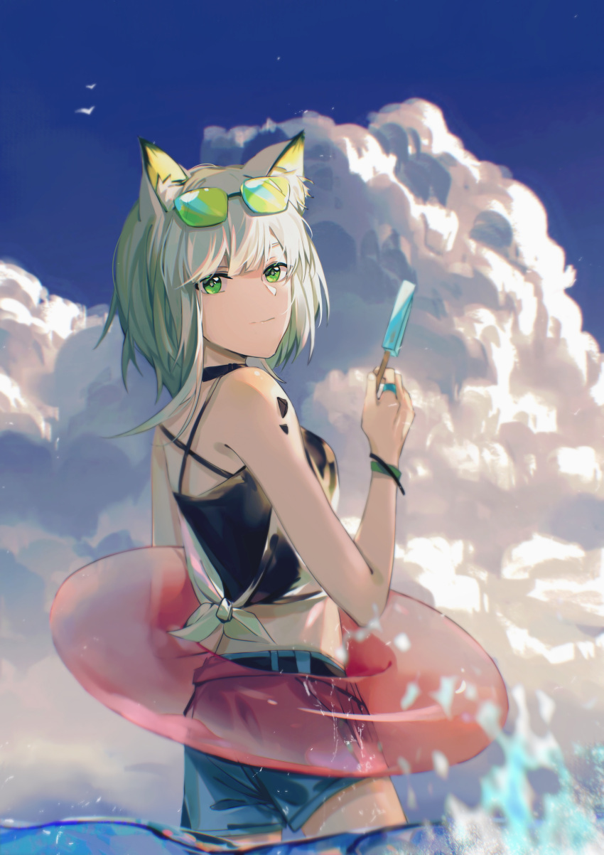 1girl, absurdres, animal_ear_fluff, animal_ears, arknights, bangs, bird, black_shirt, blue_shorts, blue_sky, bracelet, cat_ears, chinese_commentary, closed_mouth, clouds, commentary_request, cowboy_shot, criss-cross_back-straps, eyewear_on_head, food, gesiyu, green-tinted_eyewear, green_eyes, green_hair, hand_up, highres, holding, holding_food, innertube, jewelry, kal'tsit_(arknights), light_smile, looking_at_viewer, looking_to_the_side, medium_hair, ocean, oripathy_lesion_(arknights), popsicle, ring, shirt, shorts, sky, sleeveless, sleeveless_shirt, solo, tinted_eyewear, wading, water
