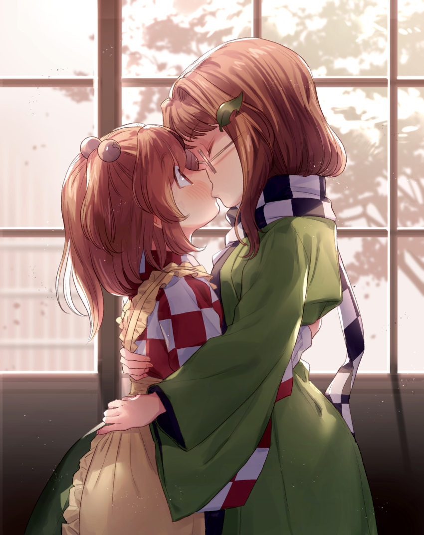 2girls, absurdres, apron, bell, blush, brown_hair, checkered, checkered_kimono, checkered_scarf, closed_eyes, eyebrows_visible_through_hair, french_kiss, futatsuiwa_mamizou, futatsuiwa_mamizou_(human), glasses, green_vest, hair_bobbles, hair_ornament, highres, japanese_clothes, kimono, kiss, leaf, leaf_on_head, long_hair, long_sleeves, masanaga_(tsukasa), motoori_kosuzu, multiple_girls, orange_hair, scarf, touhou, twintails, vest, wide_sleeves, window, yuri