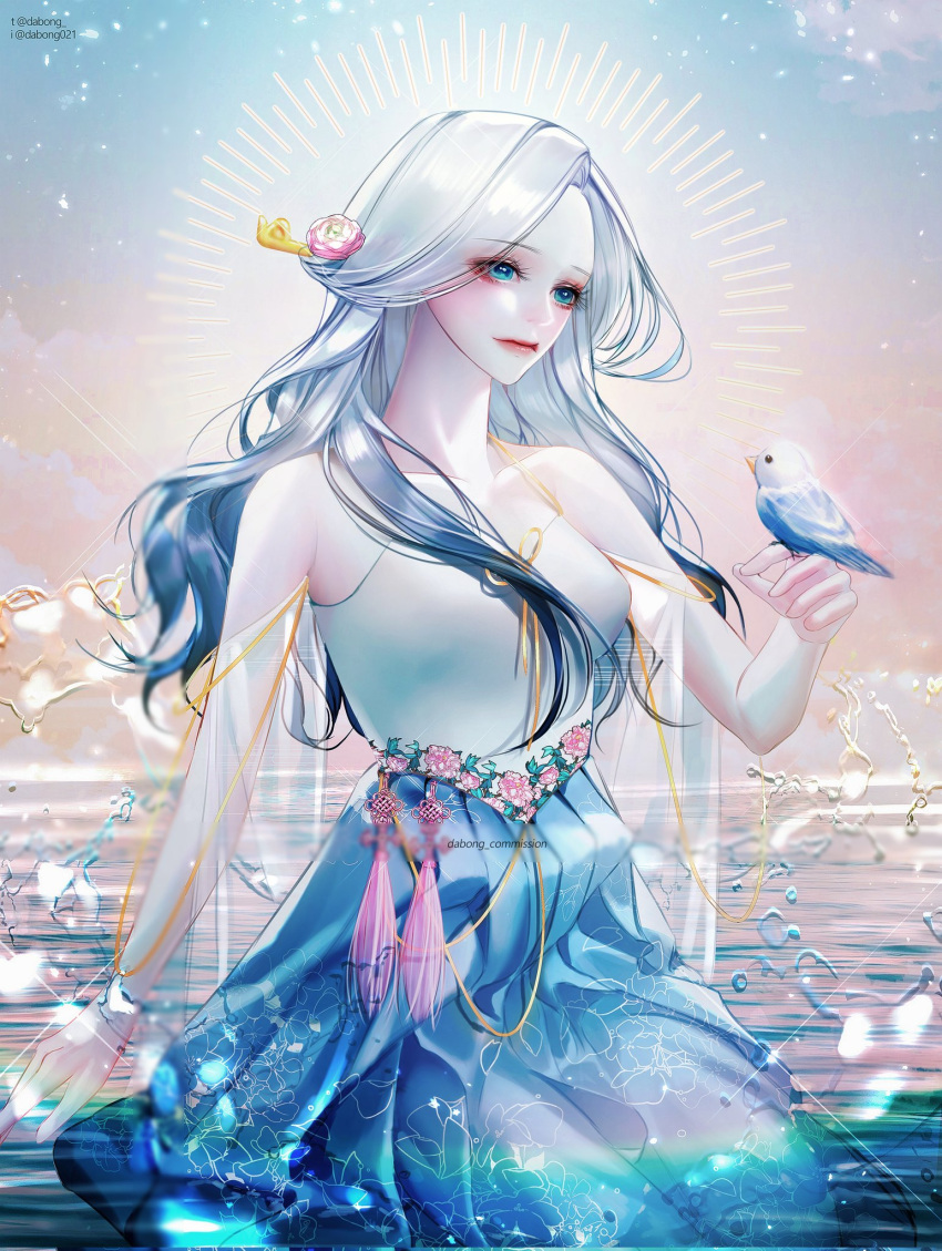 1girl, bangs, bare_shoulders, bird, bird_on_hand, blue_dress, blue_eyes, blue_hair, bracelet, brooch, dress, floral_print, flower, gradient_hair, grey_hair, hair_flower, hair_ornament, halo, highres, jewelry, kneeling_on_liquid, knot, lens_flare, looking_at_animal, looking_down, multicolored_hair, original, outdoors, parted_bangs, see-through_sleeves, sparkle, strapless, strapless_dress, tassel, water, watermark, wavy_hair, white_hair