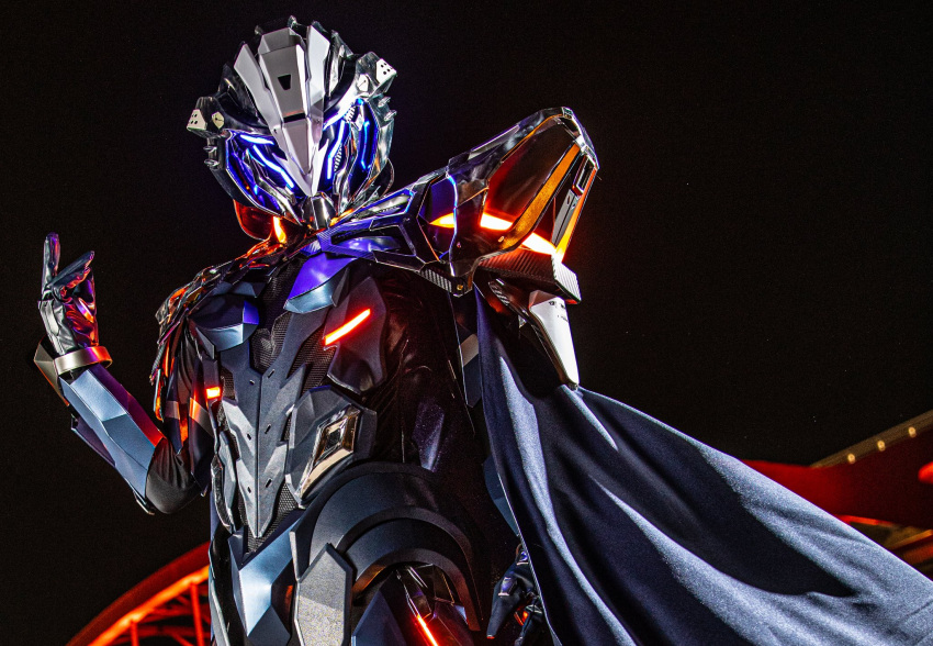 1boy, black_cape, blue_eyes, cape, cosplay, cosplay_photo, fate/grand_order, fate_(series), gloves, glowing, glowing_eyes, grey_gloves, helmet, highres, looking_at_viewer, male_focus, odysseus_(fate), odysseus_(fate)_(cosplay), power_armor, rev_(rev006010), solo
