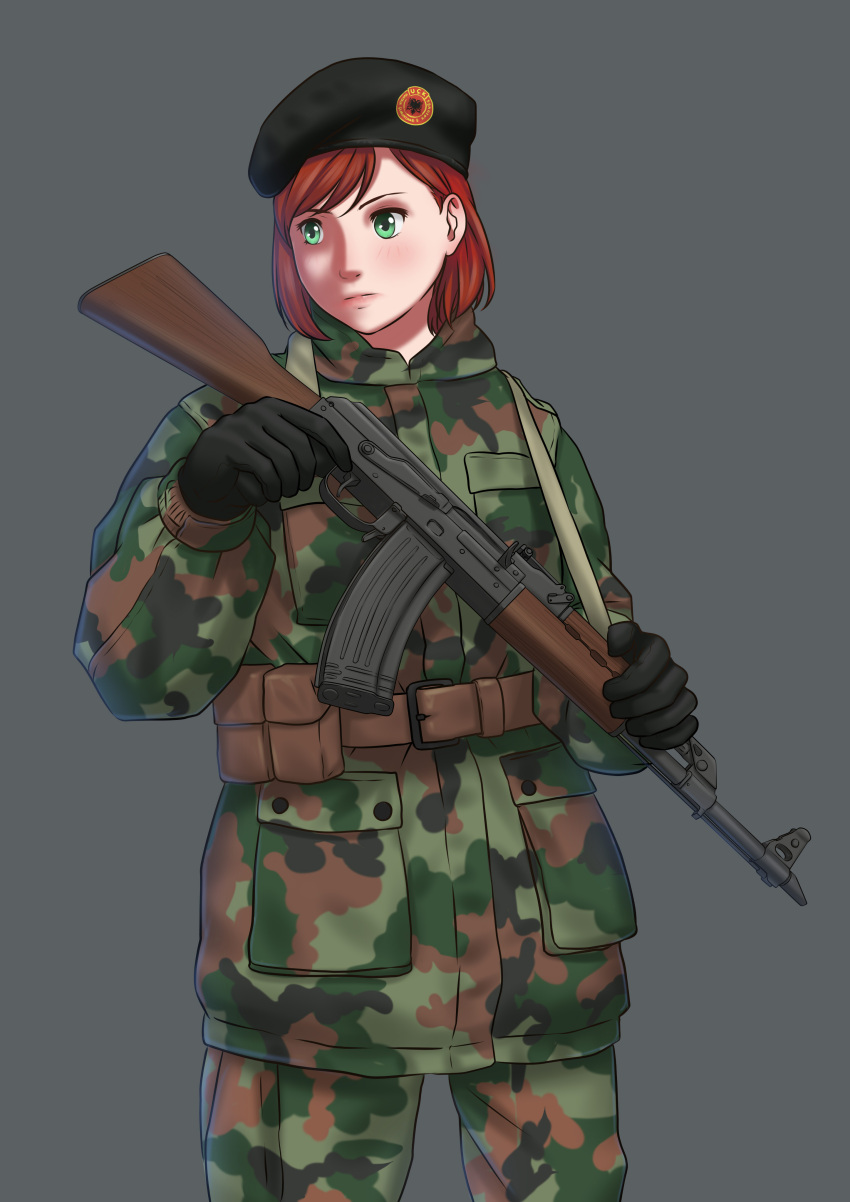 1girl, absurdres, albanian_commentary, assault_rifle, bangs, belt, beret, black_gloves, black_headwear, brown_belt, camouflage, camouflage_jacket, cowboy_shot, english_commentary, gloves, green_eyes, grey_background, gun, gunslinger_girl, hat, highres, holding, holding_gun, holding_weapon, jacket, kosovo, looking_to_the_side, mardjan, military, military_jacket, mixed-language_commentary, petrushka, pouch, redhead, rifle, serious, short_hair, simple_background, sling, solo, submachine_gun, swept_bangs, weapon, yugoslavia, zastava_m70