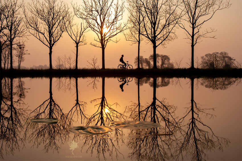 artist_request, bicycle, biker, child, commentary_request, english_commentary, ground_vehicle, highres, lake, lightning, original, outdoors, reflection, scenery, serenity, silhouette, sunrise, sunset, water