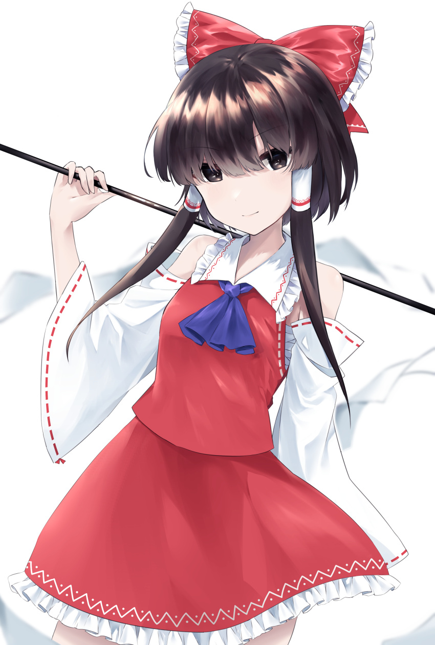 1girl, absurdres, ascot, bangs, bare_shoulders, black_eyes, black_hair, blurry, bow, brown_hair, cowboy_shot, depth_of_field, detached_sleeves, eyebrows_visible_through_hair, frilled_bow, frilled_shirt_collar, frilled_skirt, frills, gohei, grenat0120, hair_between_eyes, hair_bow, hair_tubes, hakurei_reimu, highres, holding, light_smile, looking_at_viewer, petticoat, red_bow, red_skirt, ribbon-trimmed_sleeves, ribbon_trim, shirt, sidelocks, skirt, skirt_set, solo, standing, touhou, vest, white_background, wide_sleeves