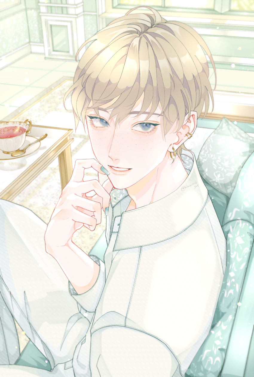 1boy, absurdres, blonde_hair, blue_eyes, commentary_request, couch, cup, ear_piercing, eyebrows_visible_through_hair, freckles, highres, nail_polish, original, piercing, rimei1226, short_hair, sitting, smile, solo, spoon, tea